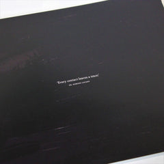 Black surface with a short quote printed in white text.